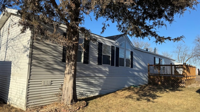 view of home's exterior featuring a deck