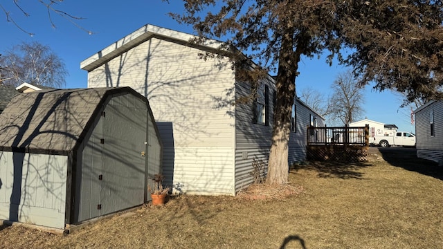 view of side of home with a wooden deck