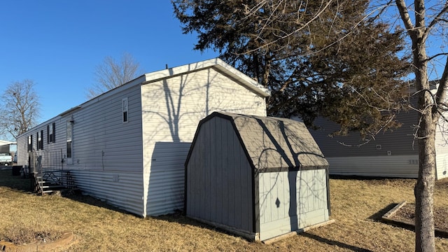 view of outbuilding with a lawn