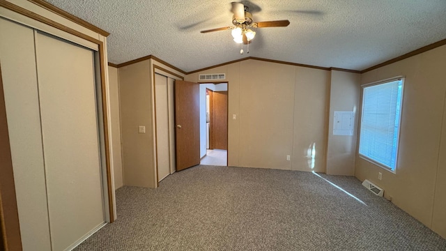 unfurnished bedroom with light carpet, ceiling fan, and ornamental molding