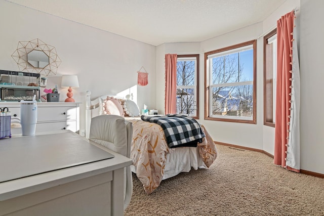 carpeted bedroom with a textured ceiling