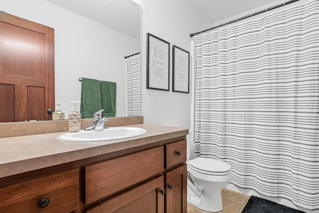 bathroom with toilet, a shower with curtain, tile patterned floors, and vanity