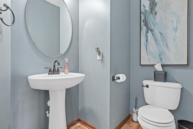 bathroom featuring toilet and hardwood / wood-style floors