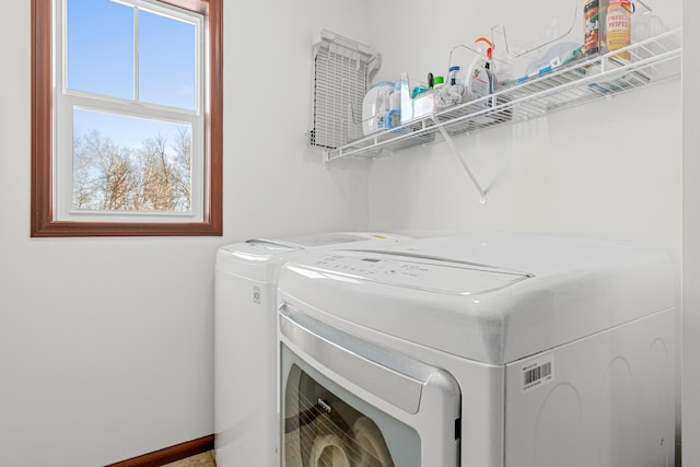 laundry area with independent washer and dryer