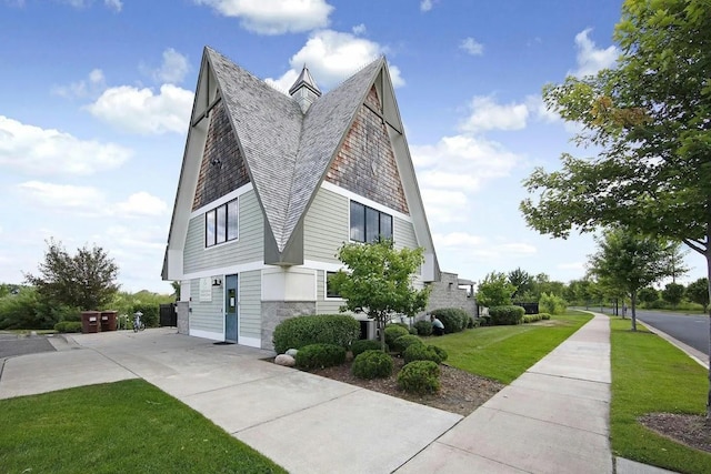 view of side of home featuring a lawn