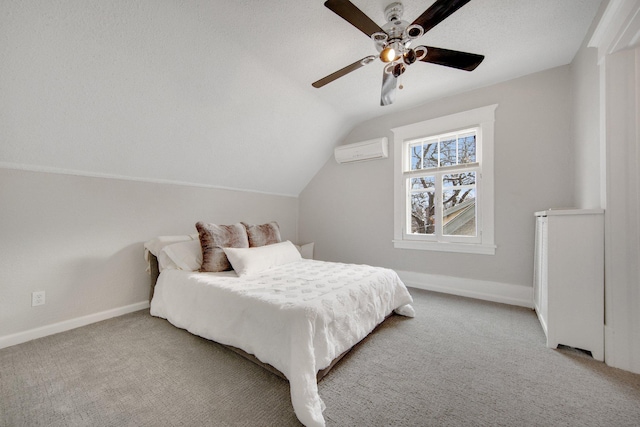 bedroom featuring an AC wall unit, ceiling fan, carpet, and lofted ceiling