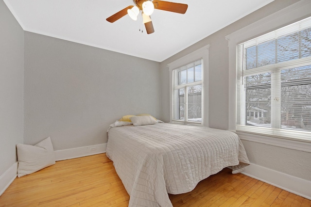 bedroom featuring ceiling fan and wood-type flooring