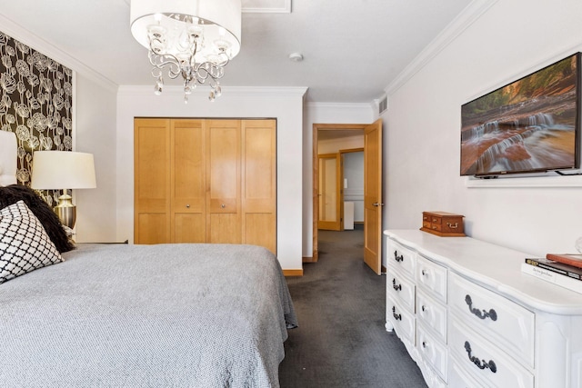 carpeted bedroom with an inviting chandelier, ornamental molding, and a closet