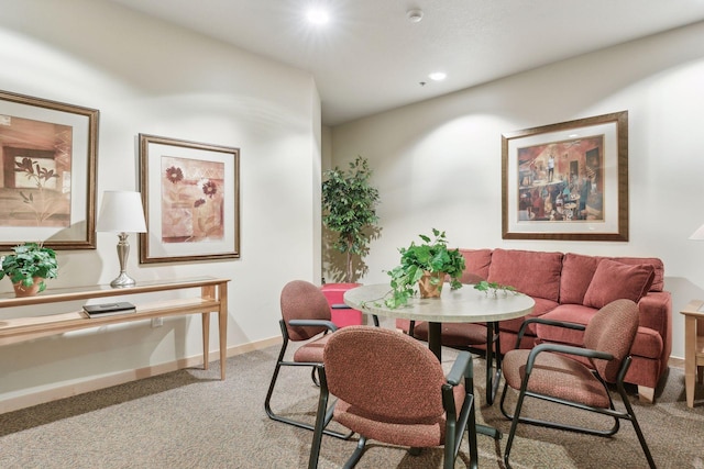 dining room featuring light carpet