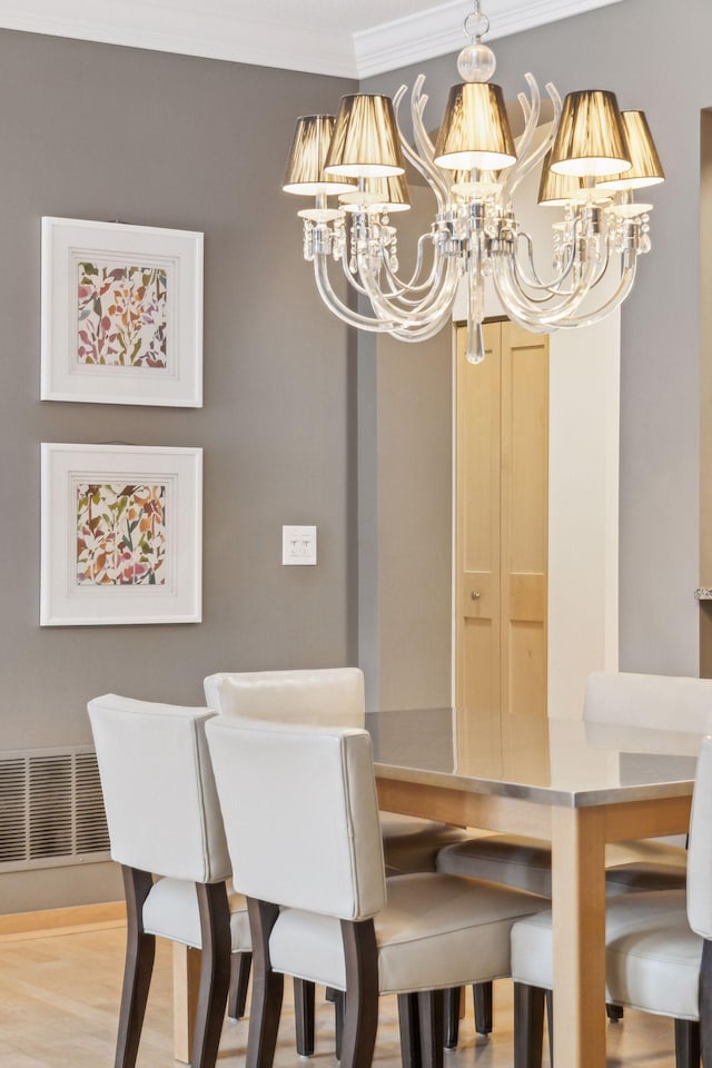 187 Sherman St, Saint Paul, MN 55102 - dining area featuring a chandelier and ornamental molding