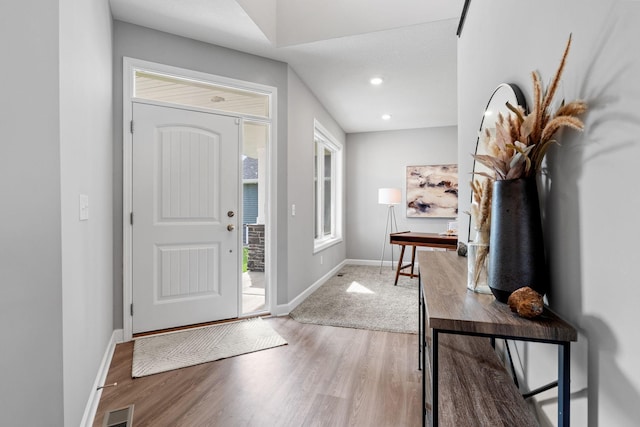 foyer entrance with hardwood / wood-style floors