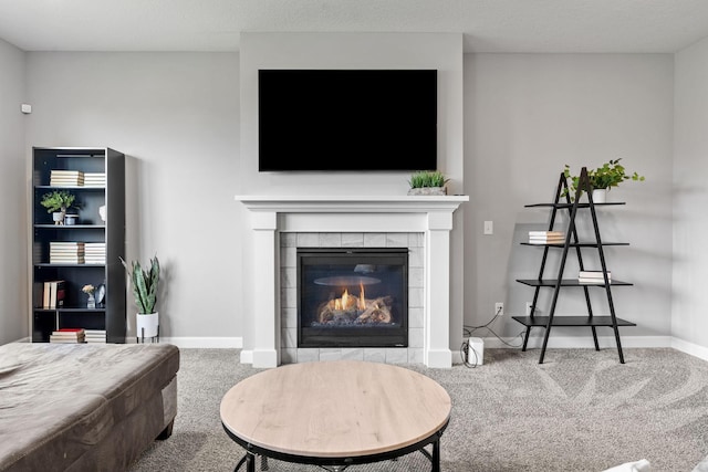 carpeted living room with a fireplace