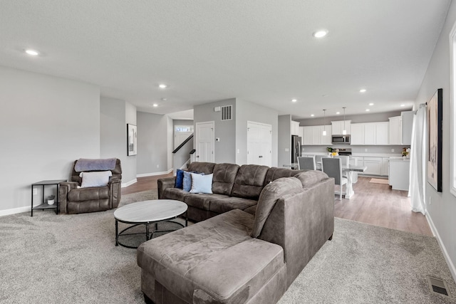 living room with light colored carpet