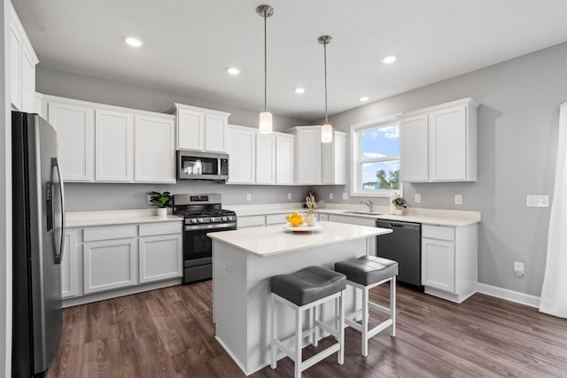 kitchen with white cabinetry, sink, and appliances with stainless steel finishes