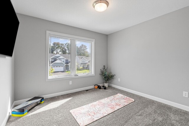 empty room with carpet flooring