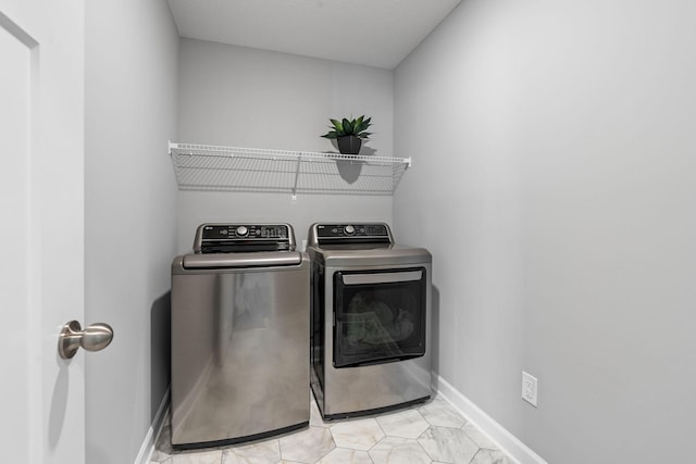 laundry room with washer and dryer