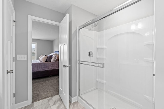 bathroom featuring a textured ceiling and an enclosed shower