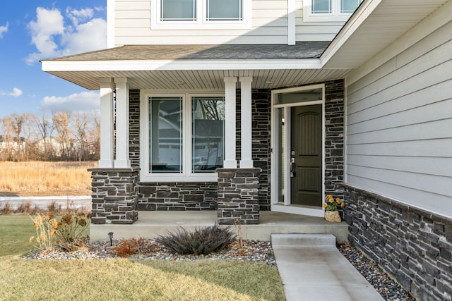 property entrance featuring covered porch