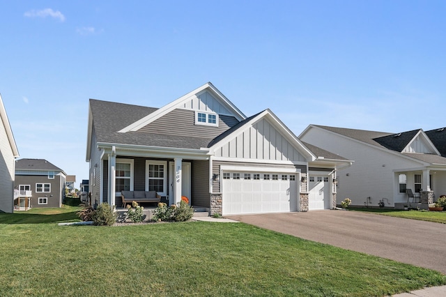 craftsman-style home with a front lawn, a porch, and a garage