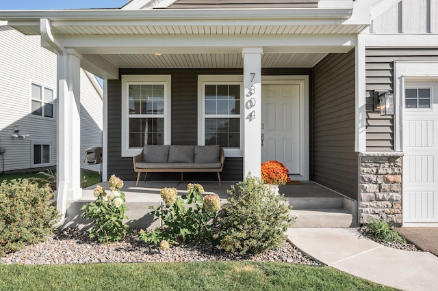 doorway to property with a porch