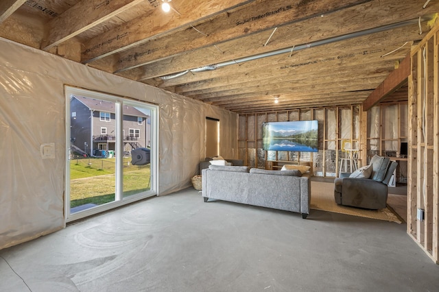 unfurnished living room with concrete floors