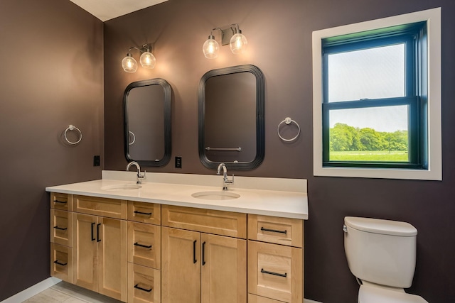 bathroom with vanity and toilet