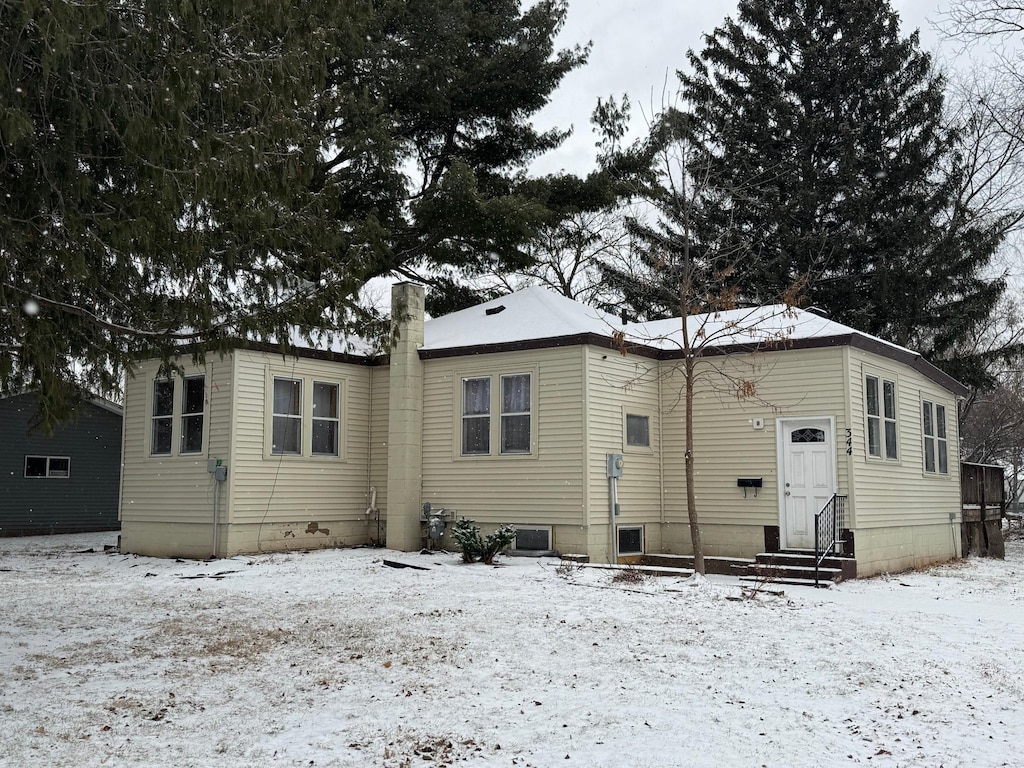 view of snow covered house