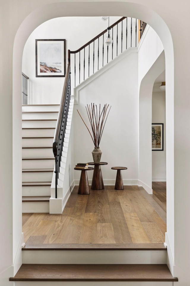 staircase featuring wood-type flooring