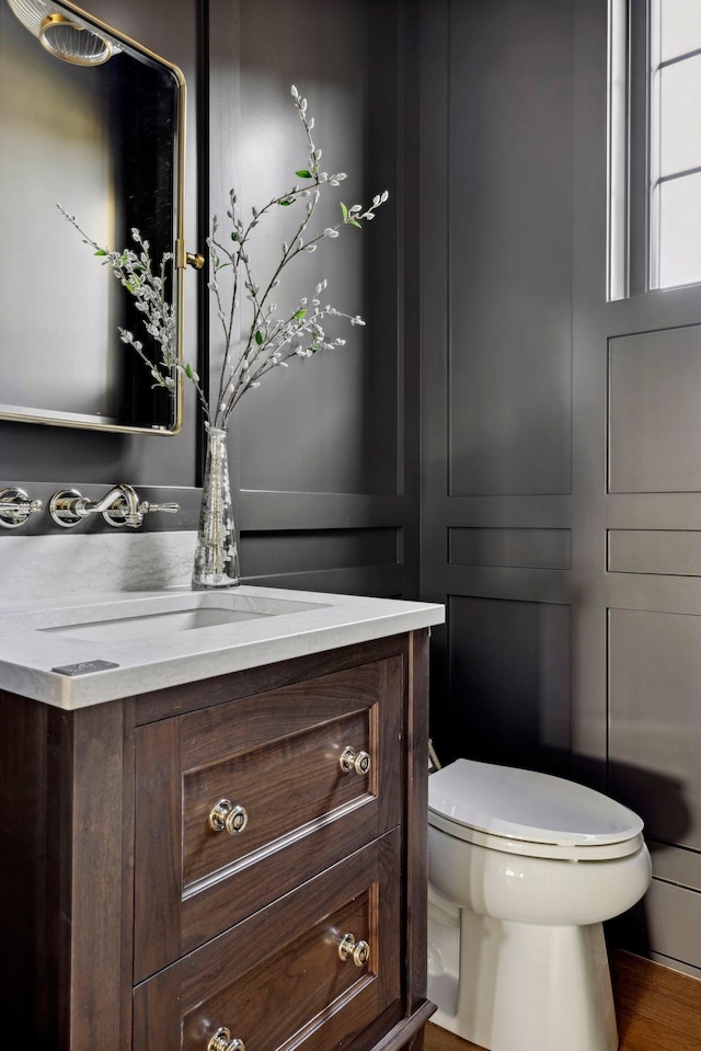 bathroom with vanity and toilet