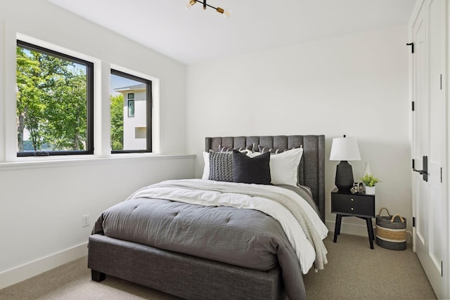 bedroom featuring light carpet