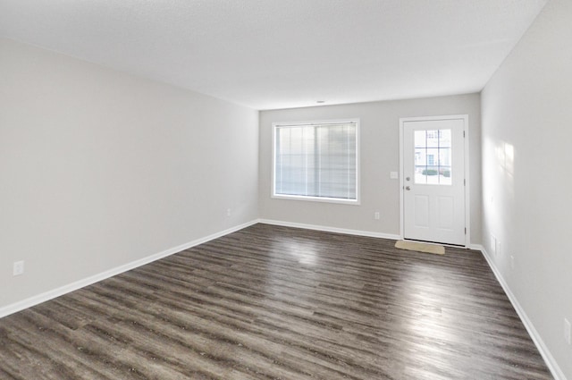 foyer with dark hardwood / wood-style floors