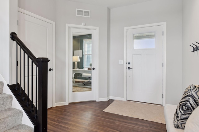 foyer featuring dark wood-type flooring