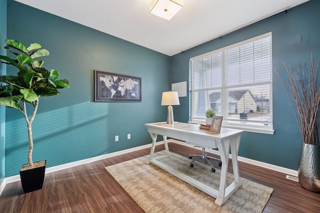 office space with dark hardwood / wood-style floors