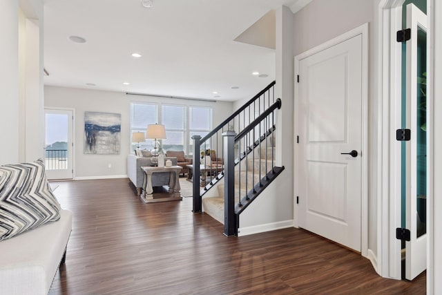 foyer entrance with dark wood-type flooring