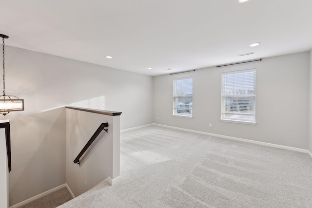 spare room with light colored carpet