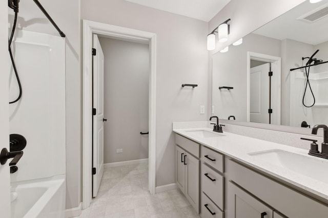 bathroom featuring vanity and  shower combination