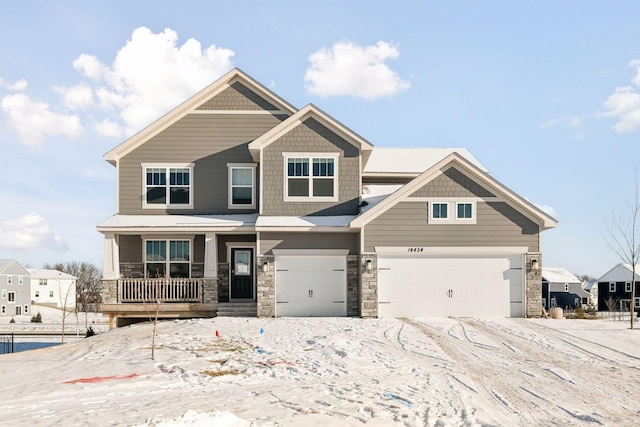 craftsman inspired home with a garage and a porch