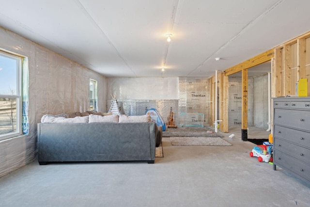 living area with concrete floors