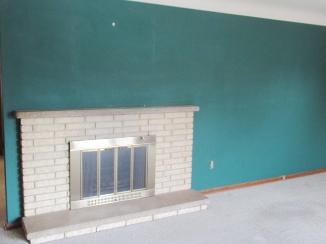 interior details with a fireplace and carpet floors