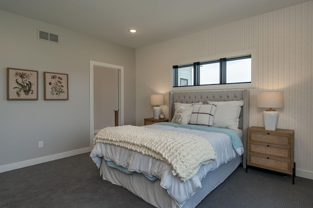 bedroom with dark carpet