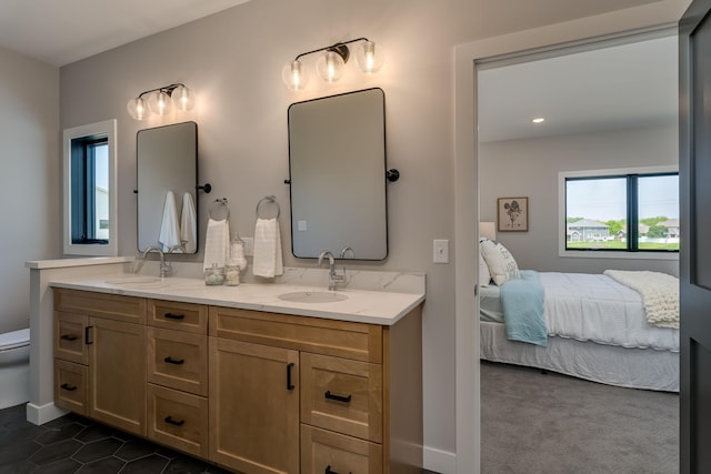 bathroom with tile patterned floors, vanity, and toilet