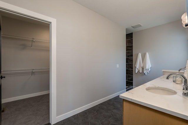 bathroom with tile patterned flooring and vanity