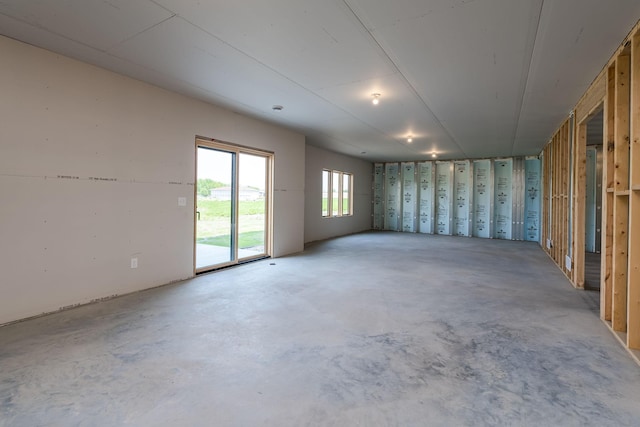 spare room with concrete flooring