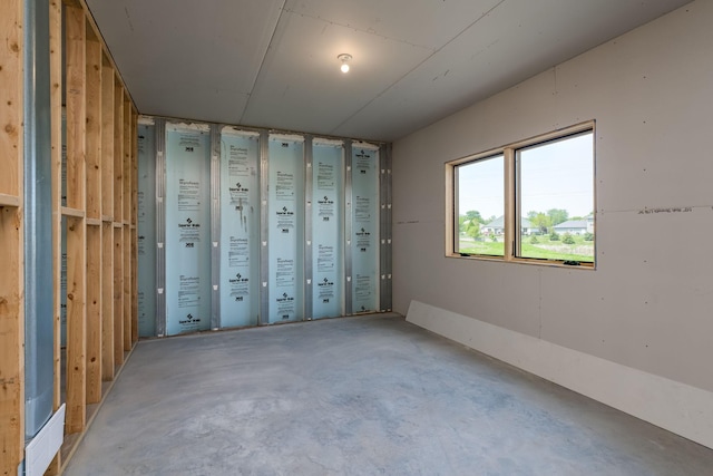 spare room featuring concrete flooring