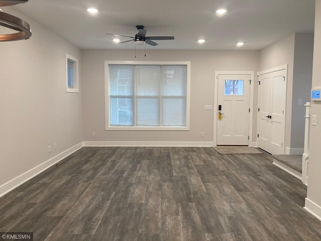 entrance foyer with ceiling fan and dark hardwood / wood-style flooring