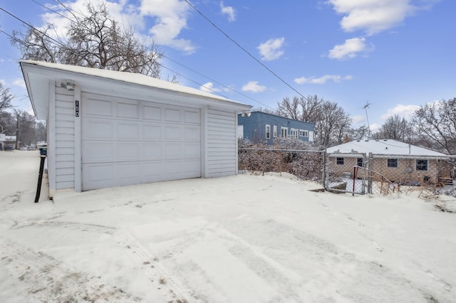 view of snow covered garage