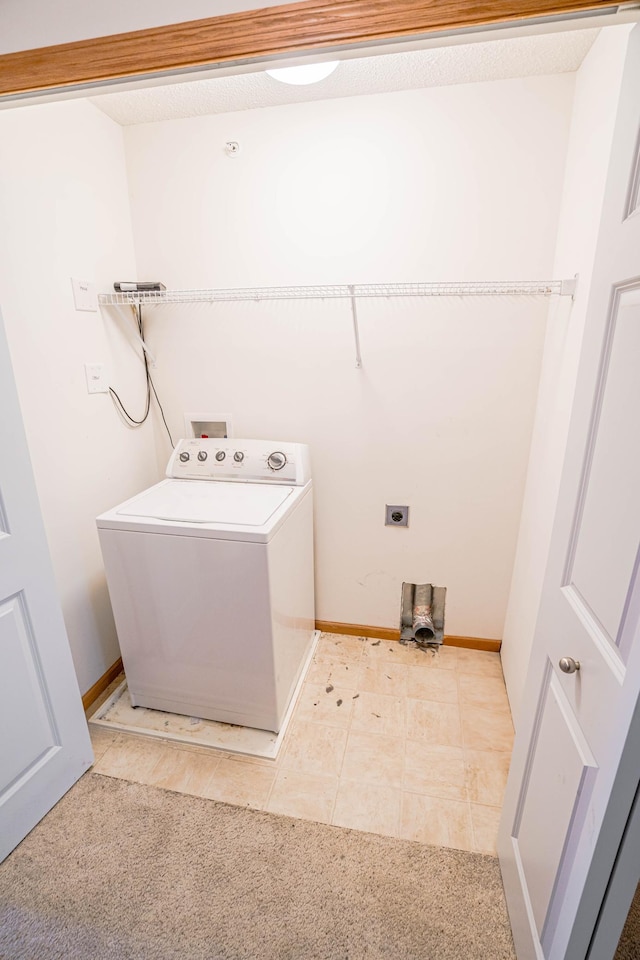 clothes washing area with light carpet and washer / clothes dryer