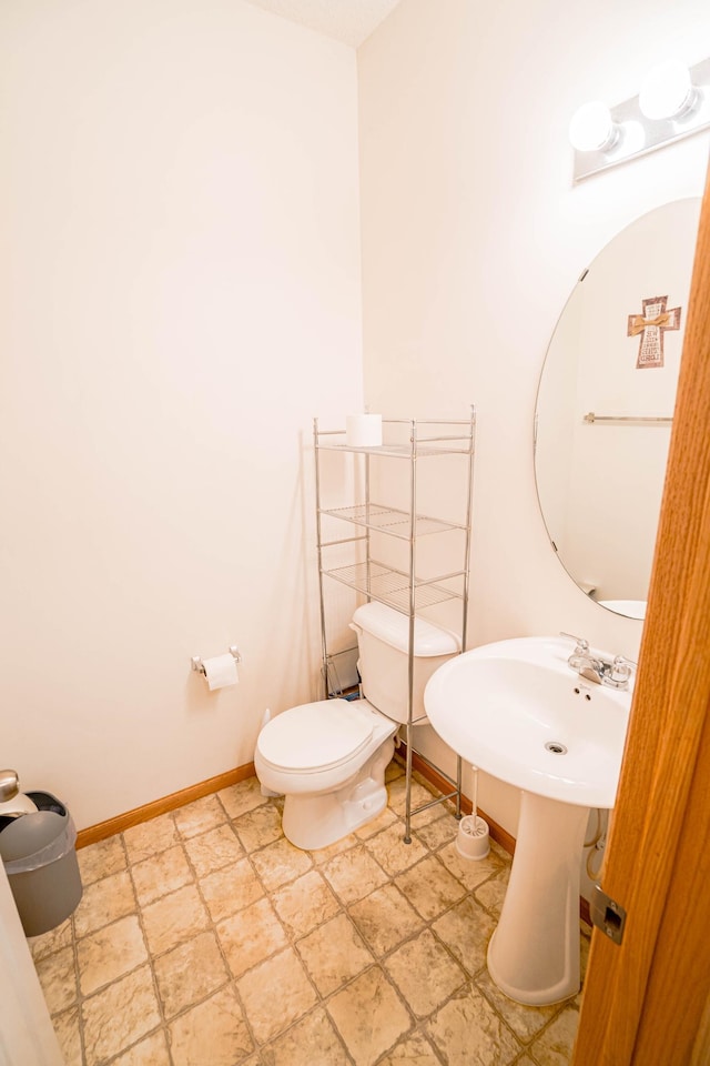 bathroom with toilet and sink