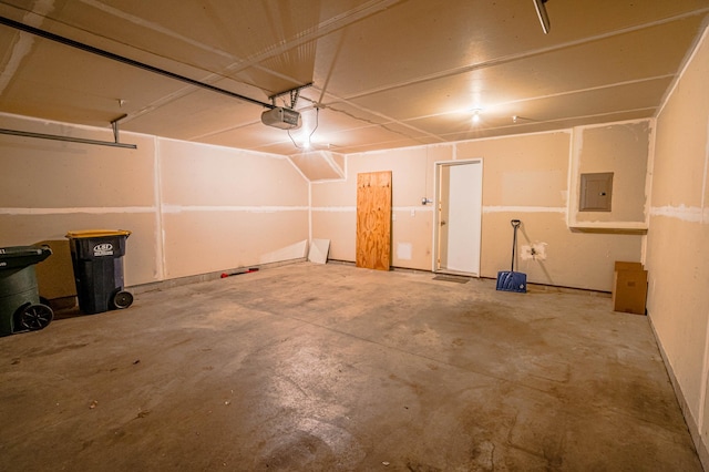 garage featuring a garage door opener and electric panel