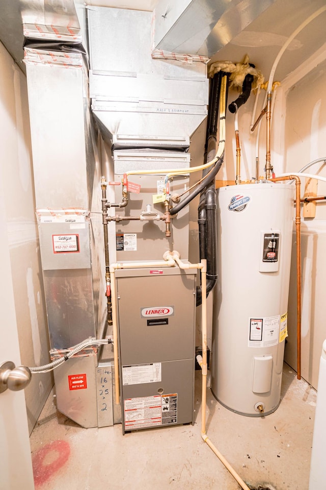 utility room featuring water heater